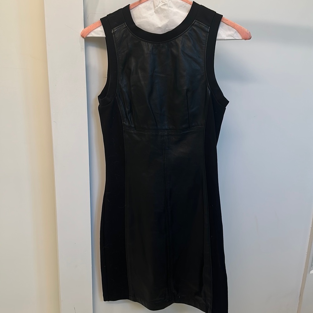 Funktional black leather dress.